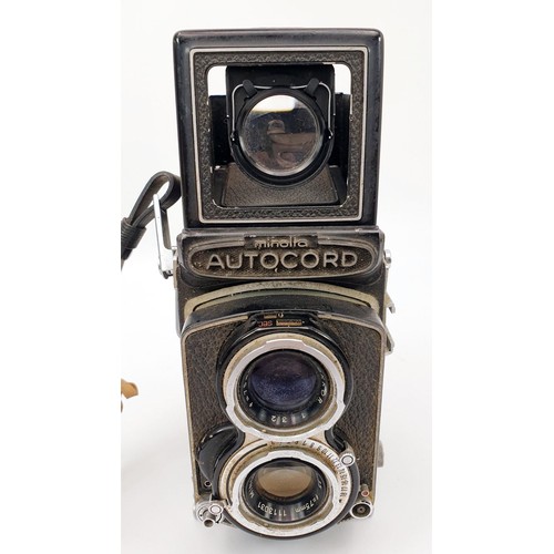 202 - A vintage Minolta Autocord Twin Lens Reflex camera with Rokkors F/3.5 75mm and F/3.2 75mm lenses. UK... 