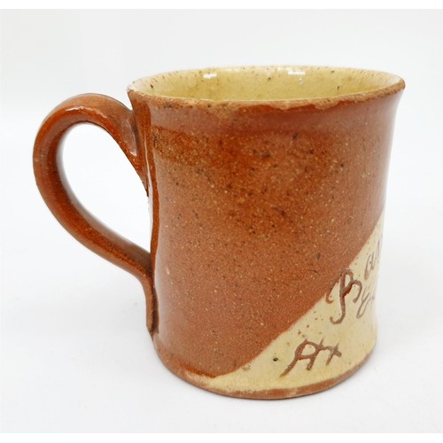 204 - A vintage slipware mug for The Bankfield Exhibition 1926, signed Nicholas Taylor to the base, height... 