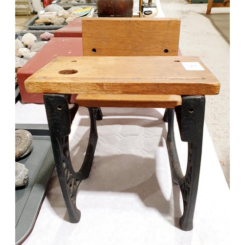 73 - A miniature school desk formed from two wrought iron brackets, height 22cm. UK shipping £14.