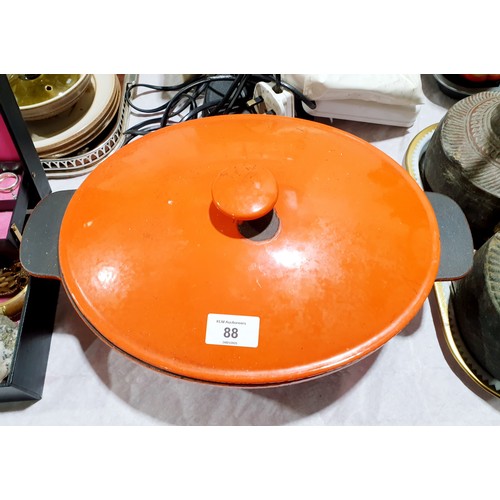 88 - A Le Creuset casserole dish, width 39cm, the lid A/F. No shipping. Arrange collection or your own pa... 