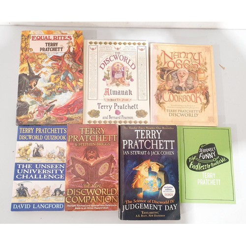 30 - A selection of Terry Pratchett Discworld and other books including Equal Rites hardback, VHS cassett... 