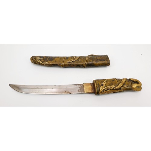 290 - An early 20th century Japanese Tanto dagger with a cast metal handle and scabbard, having relief dec... 