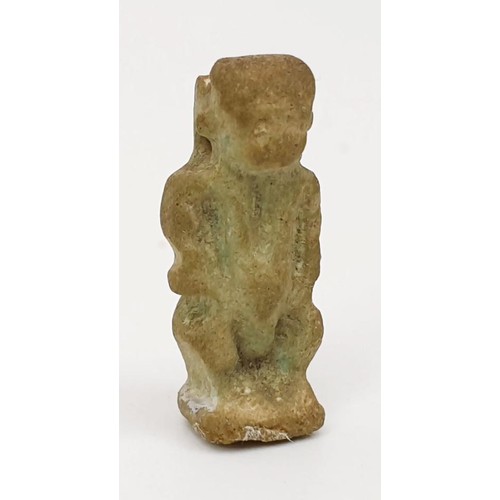 291 - A ancient Egyptian faience amulet in the form of the god  Bes, height 22mm. UK shipping £14.