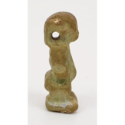 291 - A ancient Egyptian faience amulet in the form of the god  Bes, height 22mm. UK shipping £14.