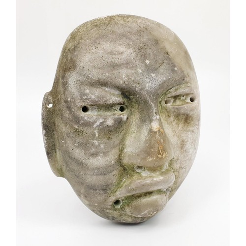 292 - A Teotihuacan hard stone mask, with some green paint remaining, length 156mm. UK shipping £14.