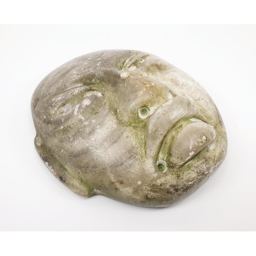 292 - A Teotihuacan hard stone mask, with some green paint remaining, length 156mm. UK shipping £14.