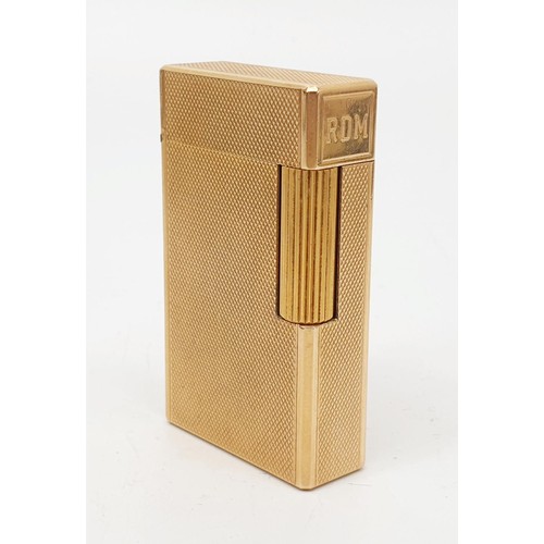 289 - A boxed S. T. Dupont gold plated lighter with paperwork. UK shipping £14.