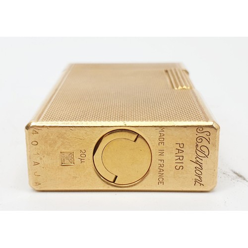 289 - A boxed S. T. Dupont gold plated lighter with paperwork. UK shipping £14.