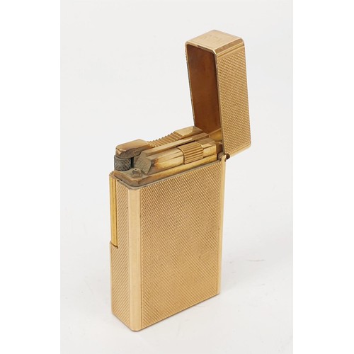 289 - A boxed S. T. Dupont gold plated lighter with paperwork. UK shipping £14.