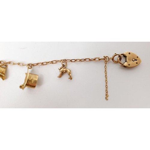 3 - A hallmarked 9ct rose and yellow gold charm bracelet, each charm hallmarked, one charm A/F, length 1... 