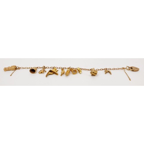 3 - A hallmarked 9ct rose and yellow gold charm bracelet, each charm hallmarked, one charm A/F, length 1... 