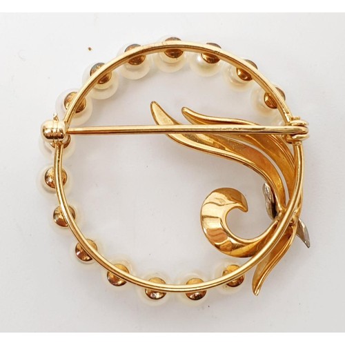 9 - A 14ct gold brooch set with pearls and a diamond, diameter 34mm, gross weight 7.5g. UK shipping £14.