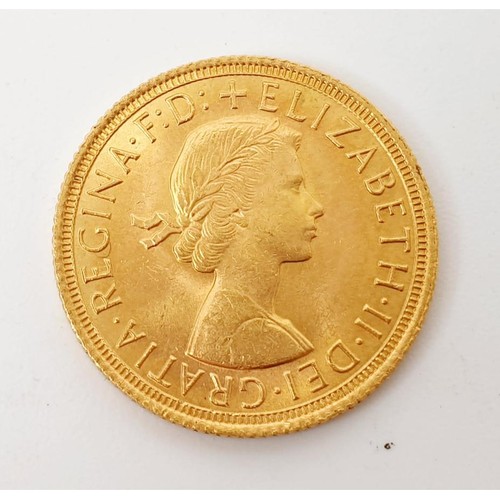 19 - An Elizabeth II sovereign, 1964. UK shipping £14.