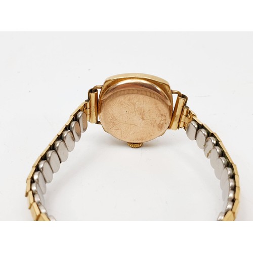 20 - A vintage ladies cocktail watch A/F, in hallmarked 9ct gold case, on a gold plated expanding bracele... 