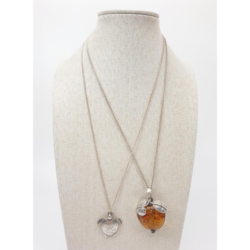 26 - A silver pendant set with amber in the form of an apple, length 4cm on a silver chain, chain length ... 