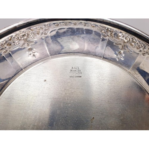 32 - A vintage sterling silver salver with chased decoration, diameter 28cm, weight 419g. UK shipping £14... 