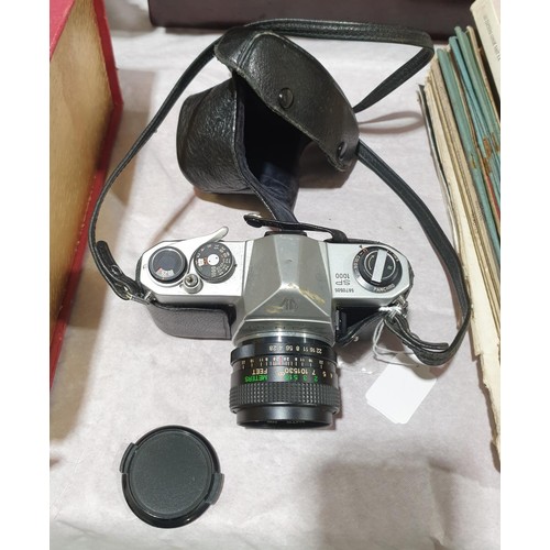 64 - A Pentax SP1000 camera with a Cosion 35mm lens. UK shipping £14.