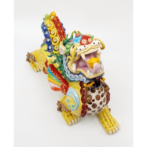 65 - A ceramic Chinese Dog of Fo/Foo, A/F, signed, length 32cm. No shipping. Arrange collection or your o... 
