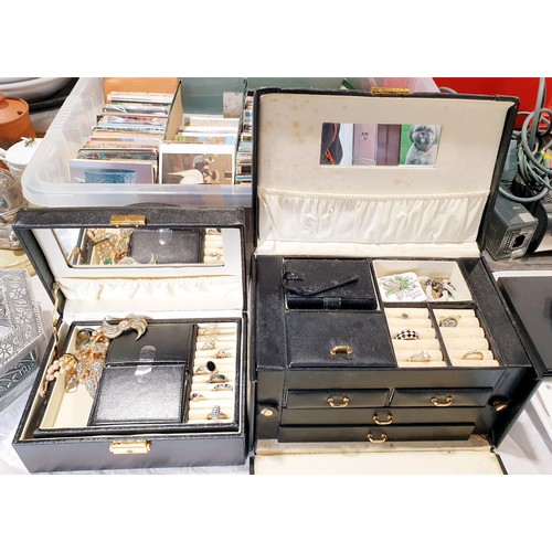 298 - Two leather jewellery boxes and contents. UK shipping £14.