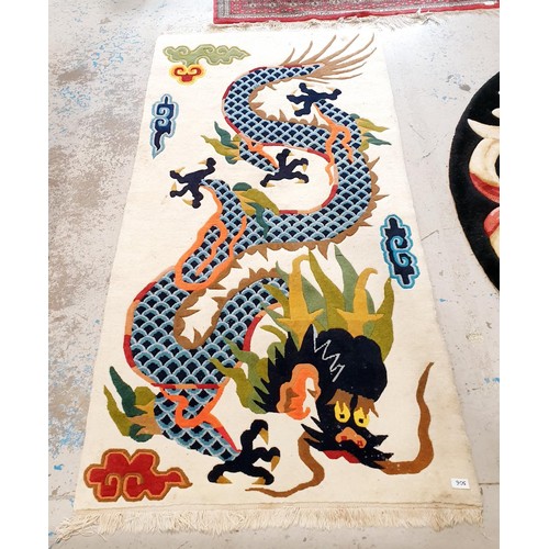 306 - A woollen dragon rug, 193x93cm. No shipping. Arrange collection or your own packer and shipper, plea... 