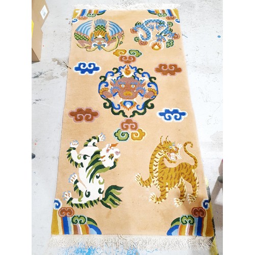 307 - A woollen dragon rug, 198x94cm. No shipping. Arrange collection or your own packer and shipper, plea... 