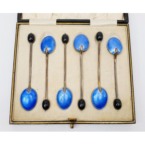 15 - A cased set of hallmarked silver coffee spoons with enamelled bowls and bean knops, one A/F, gross w... 