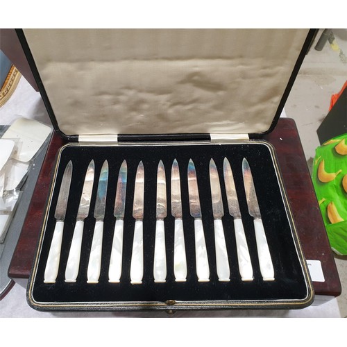 49 - A vintage cased set of fish eaters with mother of pearl handles together with eleven (of a set of tw... 