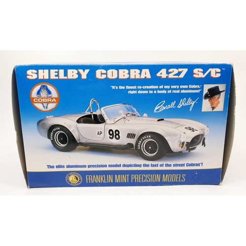 173 - A boxed Franklin Mint model of a Shelby Cobra 427 S/C, length 16.5cm. UK shipping £14.