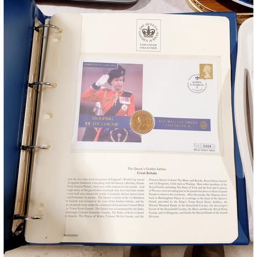 71 - Two albums of The Queen's Golden Jubilee 2002 coin covers. UK shipping £14.