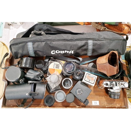 115 - An Olympus OM2 camera with an Olympus 50mm lens together with camera accessories and lenses. UK ship... 