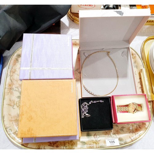 125 - A selection of costume jewellery and a Juicy Couture wrist watch. UK shipping £14.