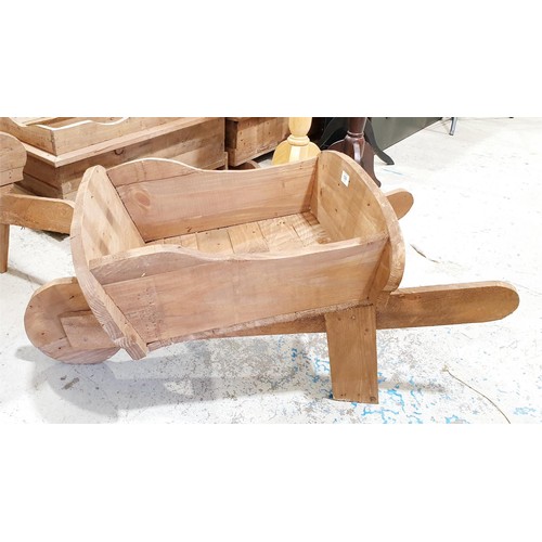 128 - A wooden planter in the form of a wheelbarrow, length 103cm. No shipping. Arrange collection or your... 