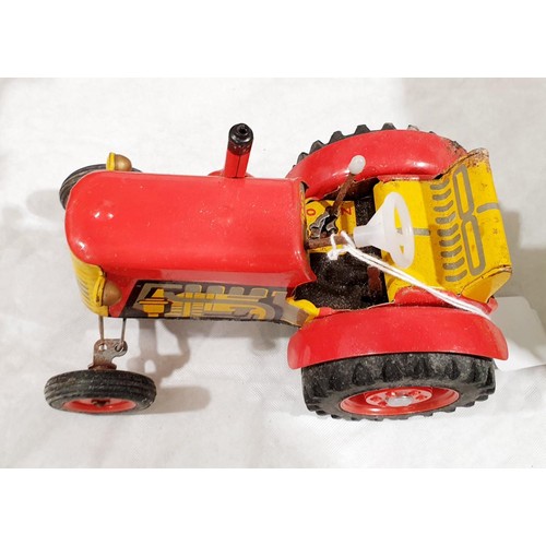 160 - A vintage Zetor tin plate clockwork tractor. UK shipping £14.