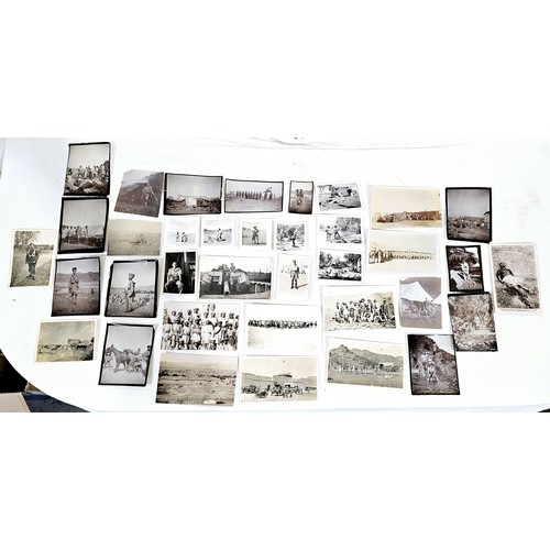 149 - A selection of vintage postcards and photographs including military. UK shipping £14.