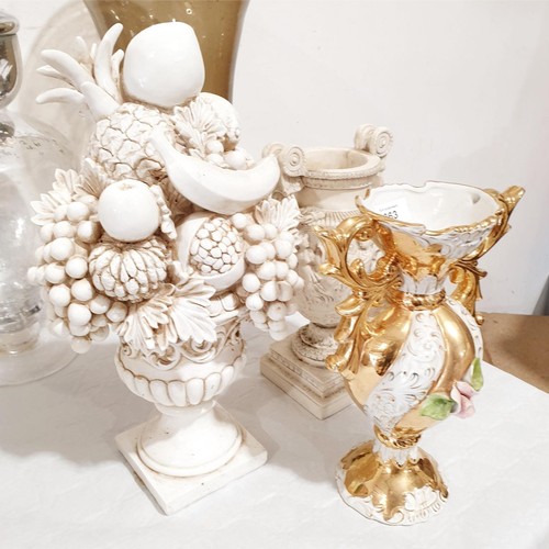 263 - A ceramic vase, a resin classical style urn and a plastic centre piece in the form of fruit, the tal... 