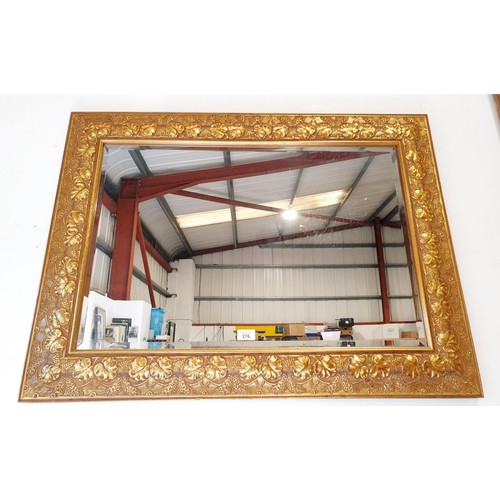 276 - A bevelled mirror in an ornate gilt frame, overall size 69x94.5cm. No shipping. Arrange collection o... 