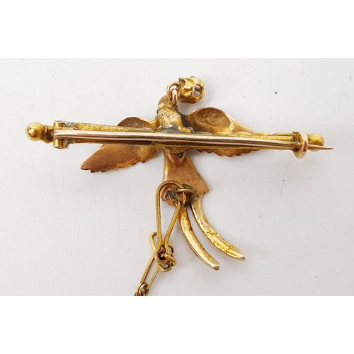 26A - A yellow and white metal brooch in the form of a pheasant in flight having a collar with a diamond s... 