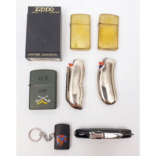 52 - A selection of cigarette lighters including two Zippos, one A/F. UK shipping £14.
