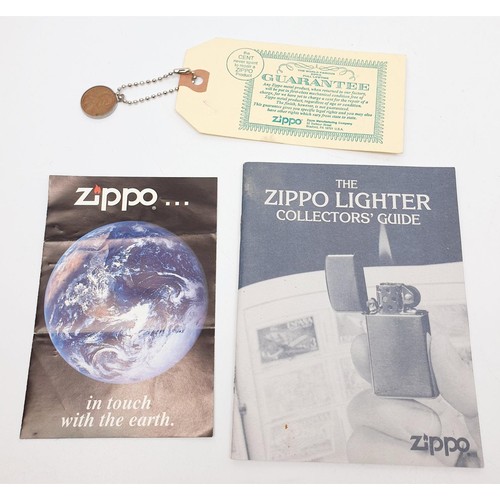 53 - A BMW Zippo lighter, a Varga Girl Zippo lighter, a Zippo 1 cent coin, Zippo ephemera and two other l... 