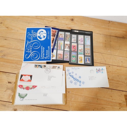 A collection of stamps and stamp packs.