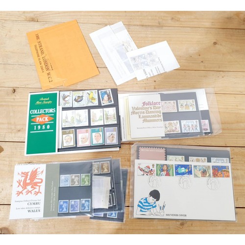 A collection of stamps and stamp packs.