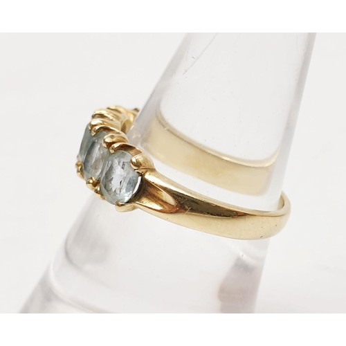 10 - A hallmarked 9ct gold ring set with five pale blue stones, gross weight 3.15g, size O. No internatio... 