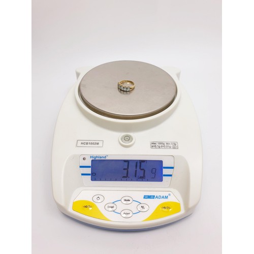 10 - A hallmarked 9ct gold ring set with five pale blue stones, gross weight 3.15g, size O. No internatio... 