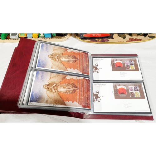36 - Two folders of Royal Mail first day covers including The Beatles. No international shipping.