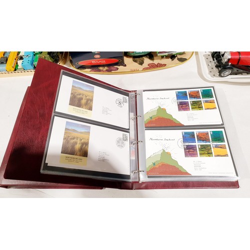 36 - Two folders of Royal Mail first day covers including The Beatles. No international shipping.