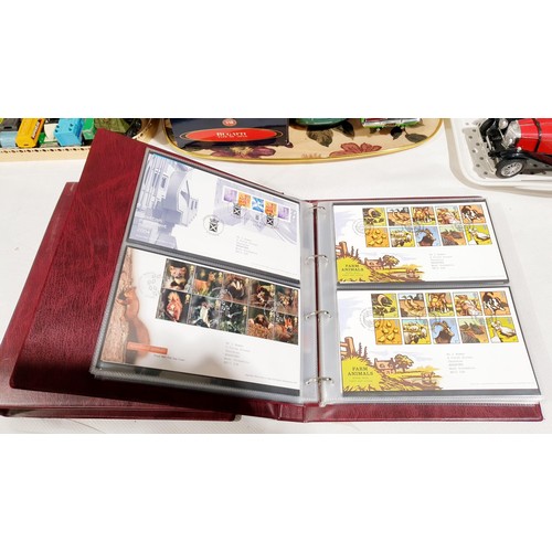 36 - Two folders of Royal Mail first day covers including The Beatles. No international shipping.
