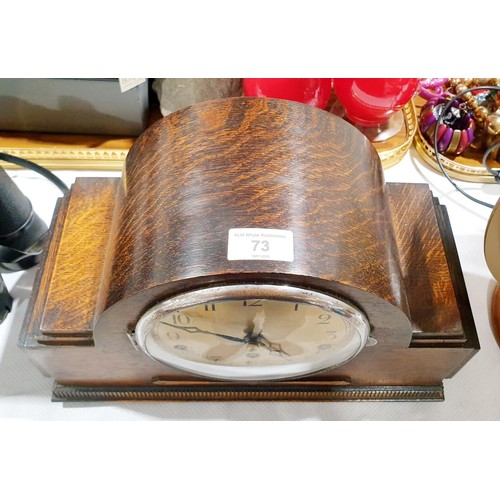 73 - An oak Art Deco mantel clock, width 34.5cm. No shipping. Arrange collection or your own packer and s... 