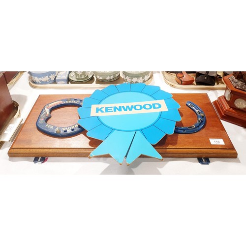 116 - Three horseshoes with Guinness advertising painted on them mounted on a wall plaque, width 65.5cm to... 