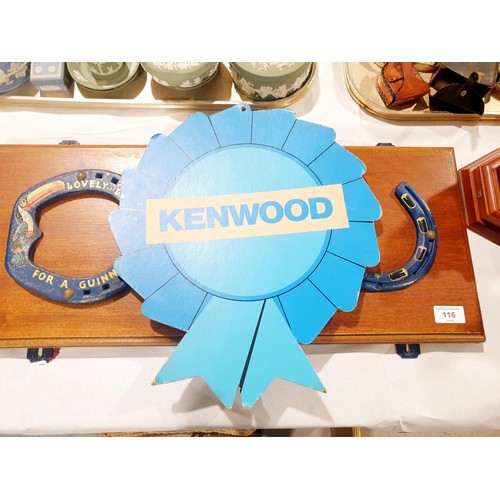 116 - Three horseshoes with Guinness advertising painted on them mounted on a wall plaque, width 65.5cm to... 