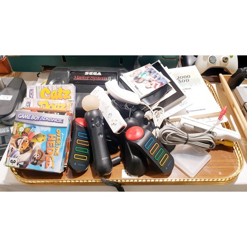 134 - A Sega Master System II console, Gameboy advance games and assorted game console accessories. No shi... 